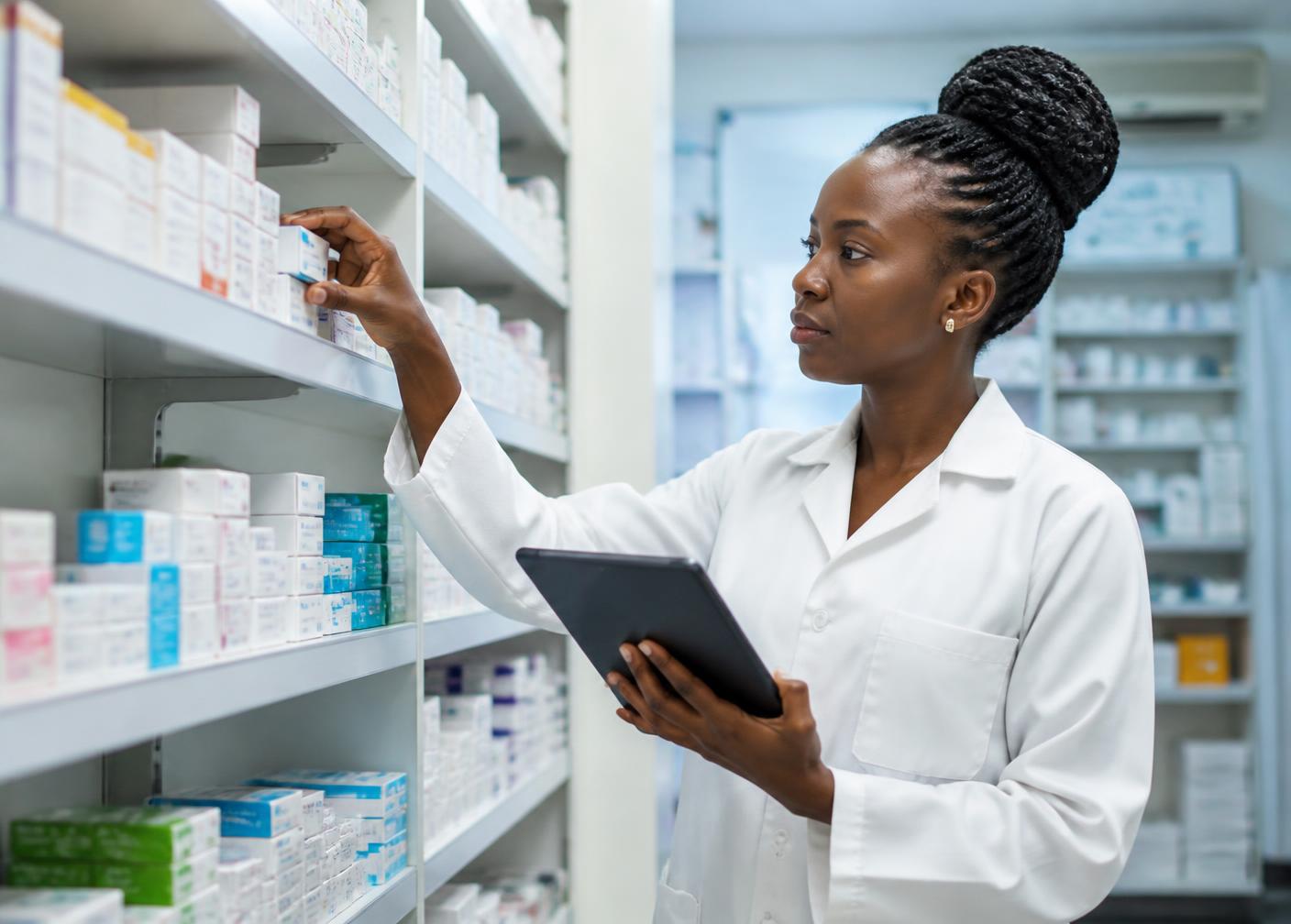 Pharmacist checking medicine inventory at Medcorp Pharmacy